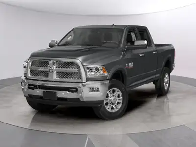 Experience the rugged capability of the 2018 Ram 2500 Laramie, presented in a sophisticated gray wit...