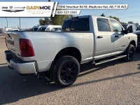 The 2026 Ram 3500 Big Horn, presented in an eye-catching silver hue, merges robust 4x4 capabilities... (image 2)