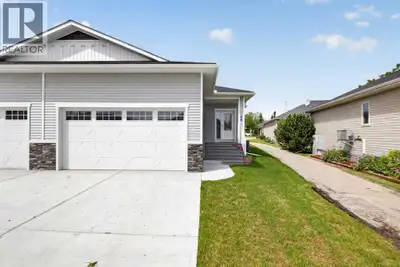 Welcome to this beautifully maintained half-duplex condo in a quiet Carstairs neighborhood, featurin...