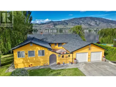 WATERFRONT LIVING AT ITS BEST! This immaculate, custom-built rancher is perfectly situated on a priv...