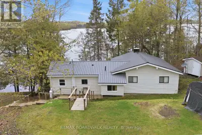 Welcome to 1091 Big Clear Lane in Arden, Ontario - a rare opportunity to own a beautiful year-round...