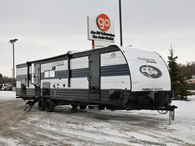 The 2026 Grey Wolf 29NM is a mid-size travel trailer with a family-friendly layout that includes a d...