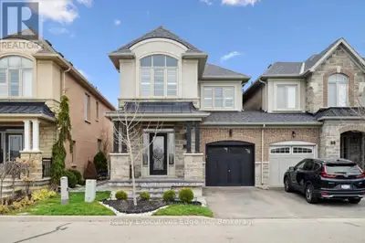 Welcome to 31 Rain Forest Ln. This beautiful freehold end unit townhome is situated on a private lan...