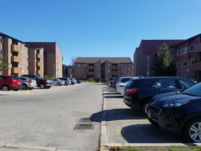1011 Dundas Street East consists of 3 apartment buildings around a communal thoroughfare with landsc...