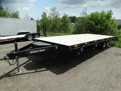 Welcome to Longhaul Trailer Sales Inc FOR RENT: 25in. flatdeck deckover equipment trailer with ramps...