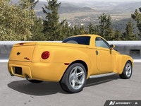 Commanding presence meets open-air freedom in this stunning Slingshot Yellow 2004 Chevrolet SSR LS,... (image 4)