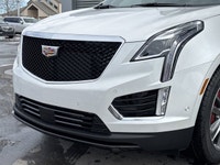 The 2026 Cadillac XT5 Sport AWD, finished in Crystal White Tricoat with a rich Kona Brown interior w... (image 2)