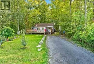 Step into comfort and convenience with this charming home nestled on a spacious, private, well treed...