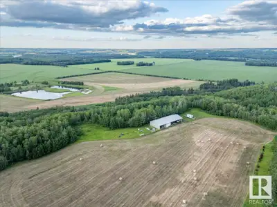 158 Acres Zoned (NSRV) North Saskatchewan River Valley. Fully Developed 30'x46' insulated shop power...