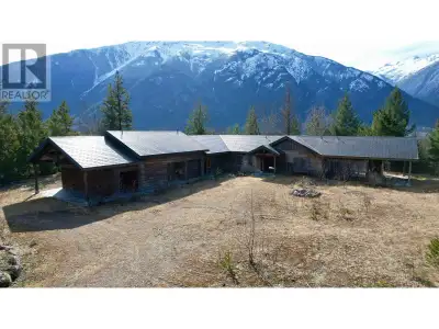 Dramatic 4,670 sq. ft. unfinished rancher/potential lodge on 198 stunning riverfront acres in Hagens...