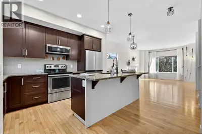 Lake Living in Mahogany! Beautifully maintained 4-bedroom, 3.5-bath semi-detached home with over 1,7...