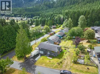 Bright + updated family home in the Village of Sayward — a welcoming community where life moves at a...