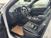 Our exclusive 2021 Jeep Grand Cherokee Limited 4X4 wraps assertive capability in a dramatic Bright W... (image 8)