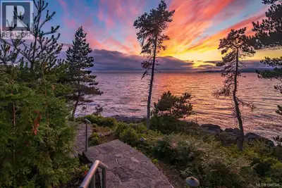 Set along the pristine shores of prestigious Silver Spray, this extraordinary East Sooke estate occu...