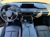 The 2025 Mazda CX-90 MHEV GS-L in a sophisticated gray finish beckons those seeking a premium drivin... (image 9)