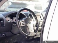 Ready for any adventure or workday, this 2018 Nissan Frontier Crew Cab Pickup in striking Glacier Wh... (image 8)