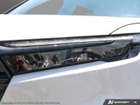 The 2026 Honda CR-V Hybrid Touring AWD in a stunning White finish is revolutionizing the SUV experie... (image 9)