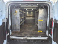 The 2023 Ford Transit Cargo Van, clad in a clean white finish and equipped with rear-wheel drive, of... (image 7)