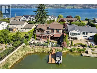 Waterfront living meets exceptional entertaining on the coveted Pritchard Canal. With a private doub...