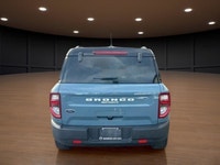 The 2021 Ford Bronco Sport Outer Banks in a striking blue finish with its capable 4x4 drivetrain off... (image 6)