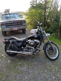 Two Harley Davidson motorcycles for sale.