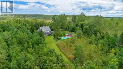 Tucked into 25 acres of forested privacy at the very end of a quiet sideroad, surrounded by conserva...