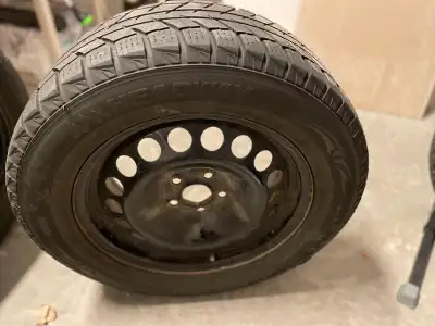 4 winter tires — great condition — used maybe one season - also have 4 Chevrolet hub caps — missing...