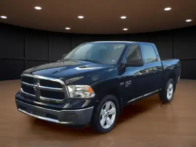 The 2022 Ram 1500 Classic SLT 4x4 Crew Cab in striking black is the perfect combination of power and...