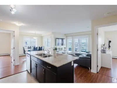 PRIME LOCATION! TOP FLOOR! CORNER UNIT! With an abundance of natural light to this top floor open co...