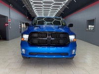 The 2021 Ram 1500 Classic Express 4x4 Crew Cab in a striking Blue finish is a true powerhouse with i... (image 1)