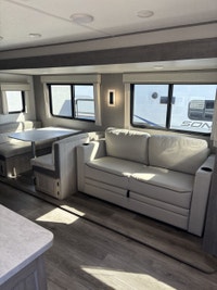 The popular 243RBS is the ideal couple’s coach! This floorplan boasts a full-size super slide with b... (image 9)