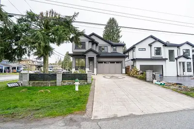 Corner property! TOTAL of 6 BDRMS & 6 BATHS over 3000 sqft of living on 3 levels. Top floor has 4 BD...