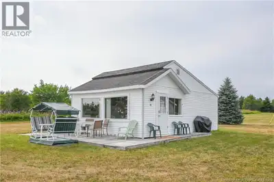 Charming Waterfront Cottage on an Exceptional Lot of Over 2 Acres! This spacious property will win y...