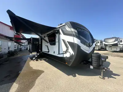 The Outback 328RL has the larger master bedroom slide, 7 foot ceilings, auto leveling, 220W solar pa...