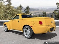 Commanding presence meets open-air freedom in this stunning Slingshot Yellow 2004 Chevrolet SSR LS,... (image 2)