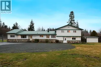 Rare 1.7-acre corner property in central Campbell River with three separate driveway access points....