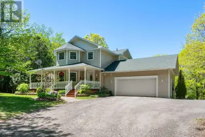 5 minutes from Merrickville is this lovely country home on 2 wooded acres. "Olde tyme' wrap around f...