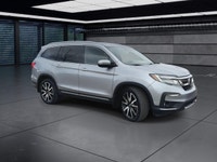 The 2021 Honda Pilot Touring 8-Passenger AWD in Silver is an exceptional choice for those seeking a... (image 1)