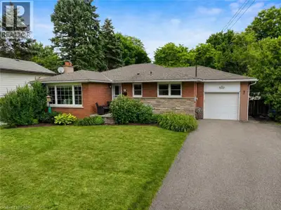 RARE PARK-BACKING BUNGALOW IN ALDERSHOT WITH IN-LAW SUITE AND COMMUTER-FRIENDLY LOCATION Experience...