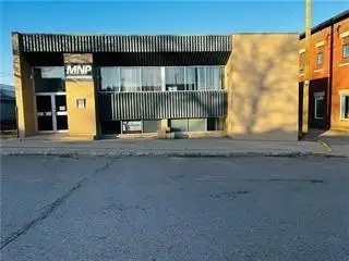 R33//Melita/Well maintained & well built office building located in prime high traffic area on Main...