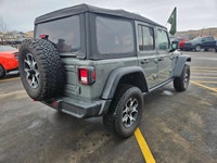The 2022 Jeep Wrangler Unlimited Rubicon 4x4 in striking Gray awaits you with its robust handling an... (image 3)