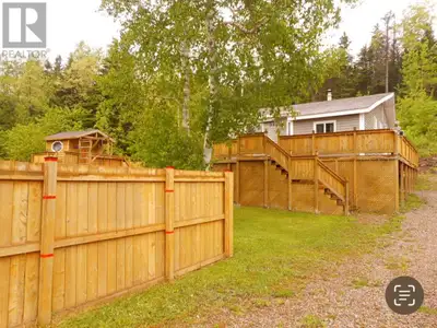 Beautiful cottage on 160 x 100 lot with a 26 x 24 garage!!! Large kids playhouse with swing set and...