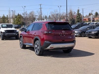 This pre-owned 2023 Nissan Rogue Platinum is finished in a beautiful Red paint with a refined Graphi... (image 3)