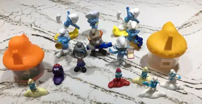 McDonald Smurf’s, 14 figures and 2 houses. Dated 2011 to 2017. $60 CAN. Near Mint Includes Smurfette...