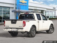 Ready for any adventure or workday, this 2018 Nissan Frontier Crew Cab Pickup in striking Glacier Wh... (image 4)