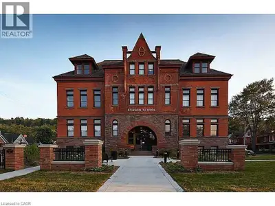 Welcome to Unit 211 at the iconic Stinson School Lofts — a rare opportunity to own a true hard left...