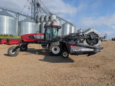2009 Macdon M200 Windrower Swather. Engine hrs: 2,767 Header HRS: 1811 Cat Motor 200hp. D60D header...