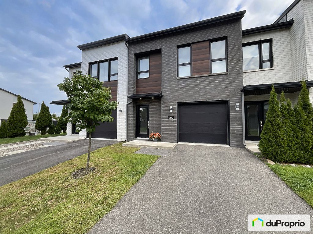 $549,000 - Townhouse for sale in St-Eustache — photo 1