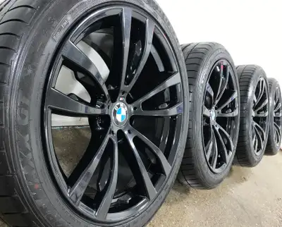 BMW X5 20 Inch OEM / Original style M469 gloss black staggered wheels and run flat summer tires for...
