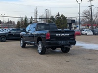 The 2026 Ram 2500 Laramie Mega Cab in Diamond Black Crystal Pearl combines heavy-duty capability wit... (image 3)
